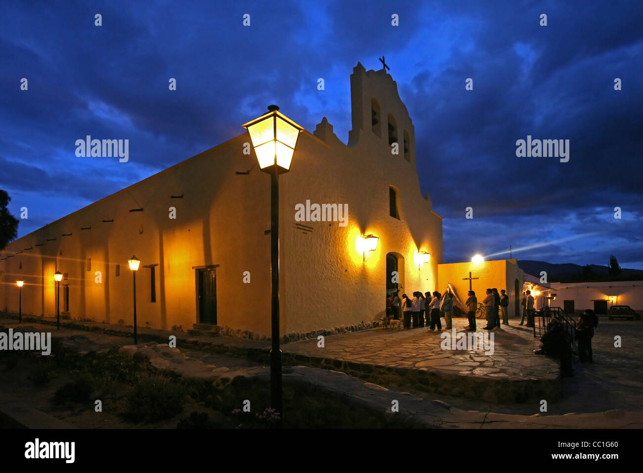 Churchgoers going to Mass in church in the evening at Cachi, Salta Province, Argentina Stock Photo