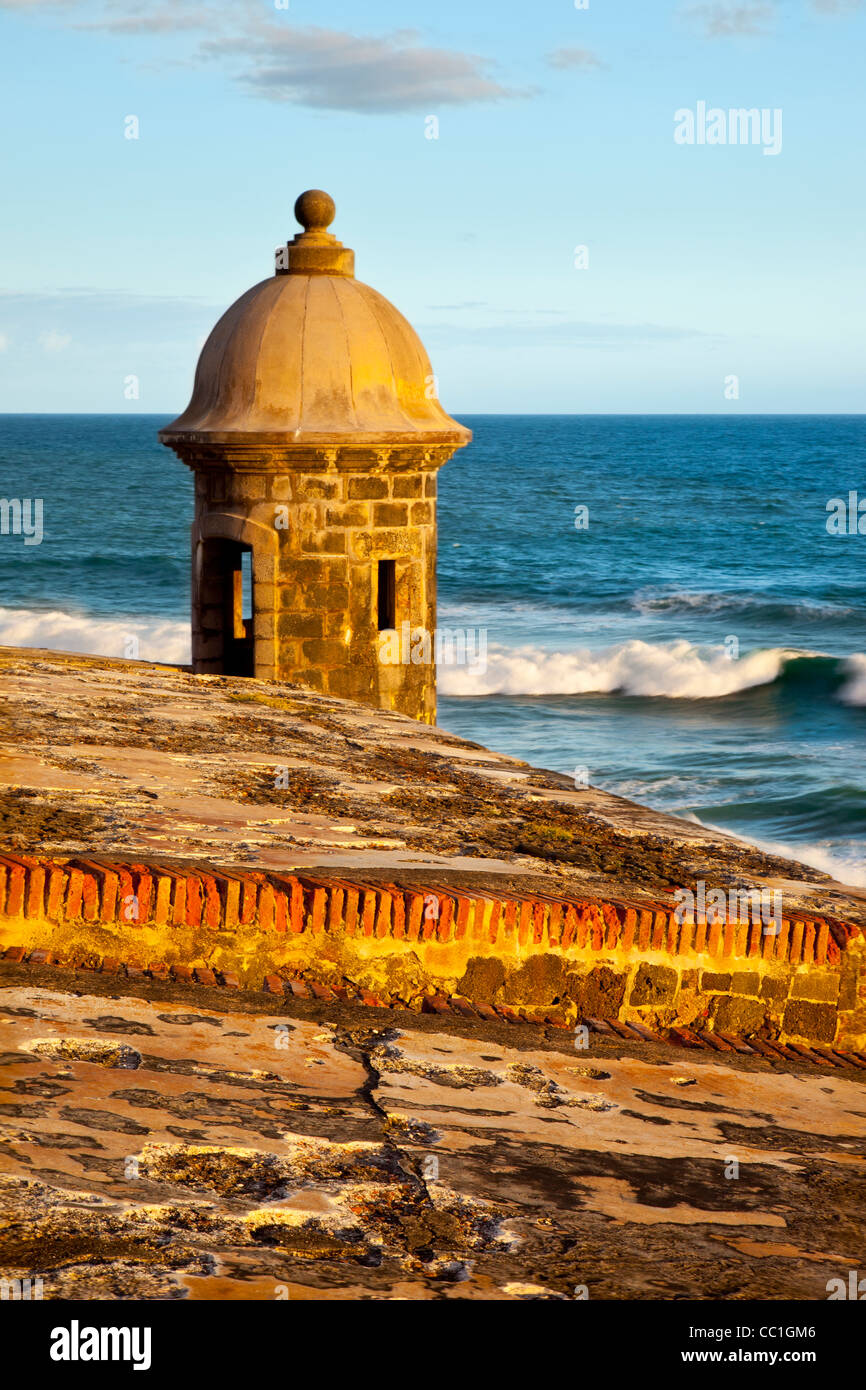 Sentry turret at sunrise overlooking the Caribbean along the walls of historic El Morro Fort, San Juan Puerto Rico Stock Photo