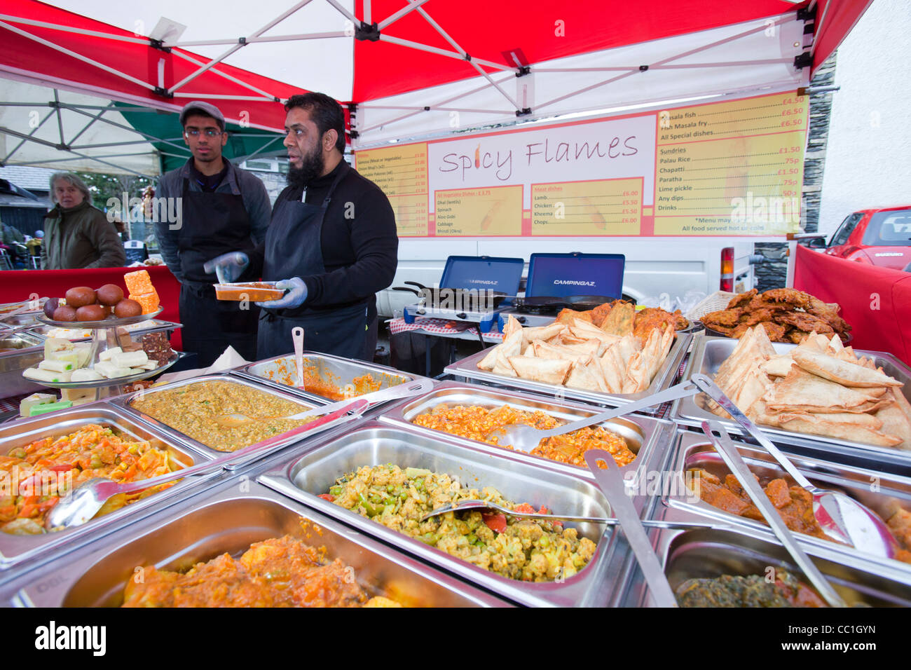 An Indian food stall at a farmers market in Cark in Cartmell, Cumbria, UK. Stock Photo