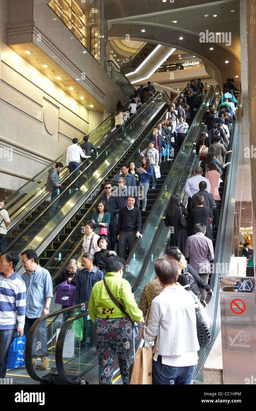escalators in times square shopping centre and office tower complex clock hong kong hksar china asia Stock Photo