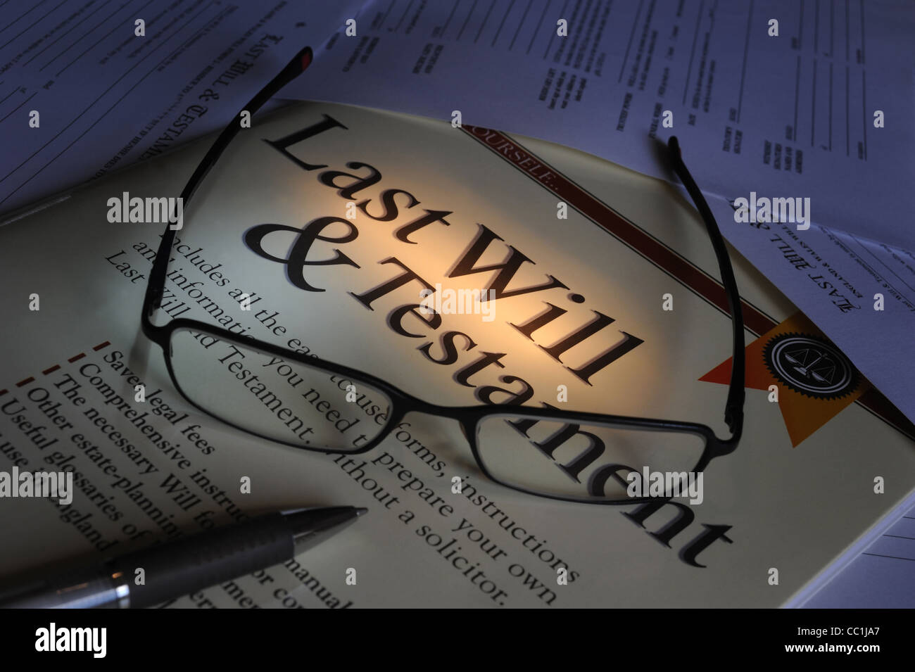 LAST WILL AND TESTAMENT FORMS WITH SPECTACLES RE MAKING A WILL FUTURE SAVINGS INHERITANCE TAX FAMILY DEATH LEGACY DONATION UK Stock Photo
