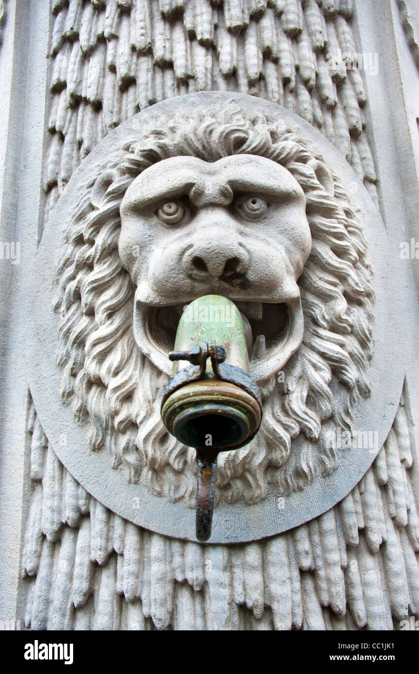 Lion head water pump spout sculpture in Bruges Belgium Stock Photo