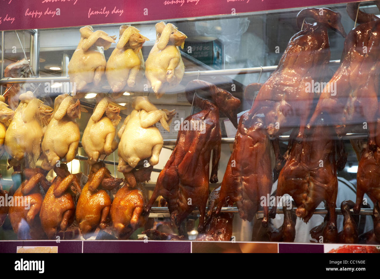 siu mei roasted bird meats hanging in a restaurant window hong kong hksar china asia Stock Photo
