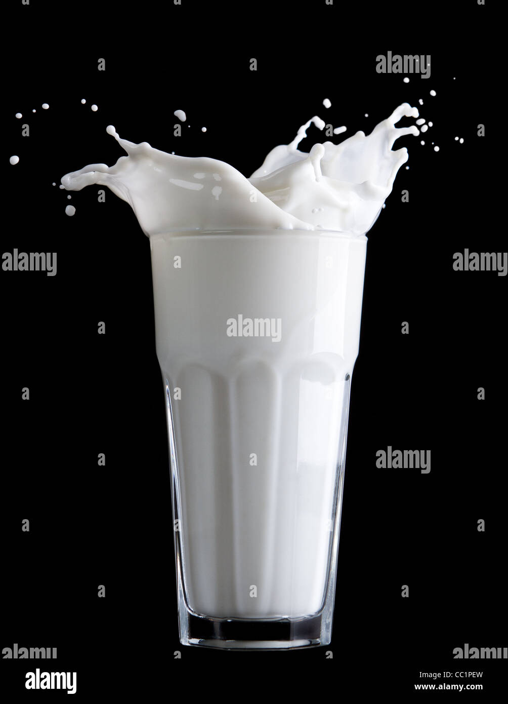 milk glass and milk splash on black background Stock Photo