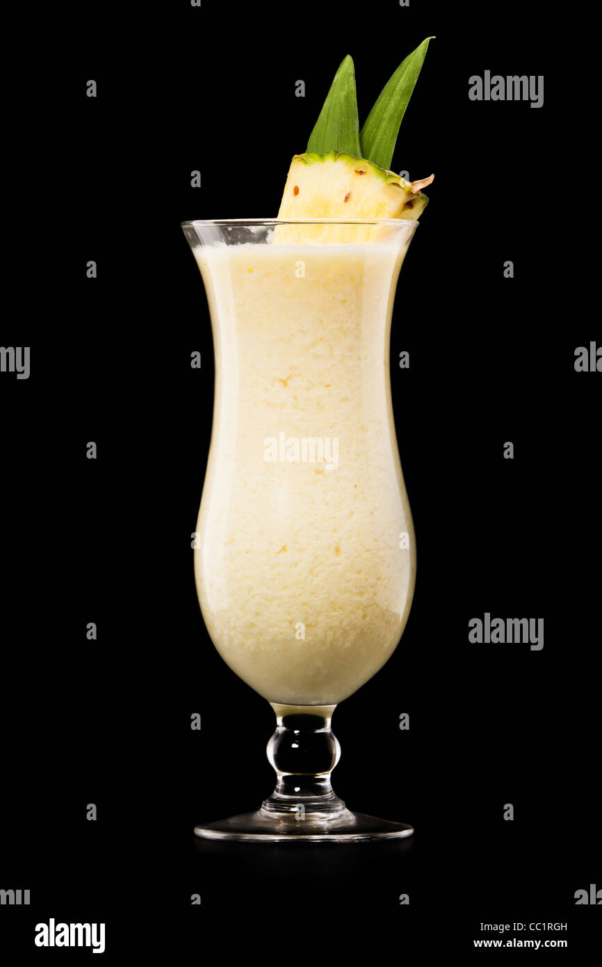 Pina colada drink cocktail glass isolated on black background Stock Photo