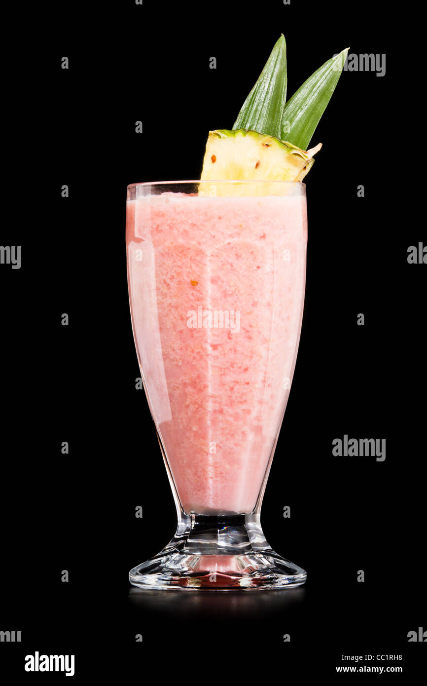 Strawberry Pina colada drink cocktail glass isolated on black background Stock Photo