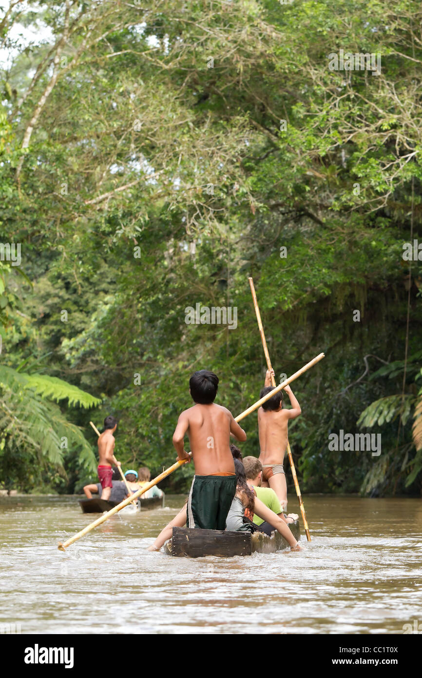 Child Driving Tourists Boats On The Pastaza River Stock Photo