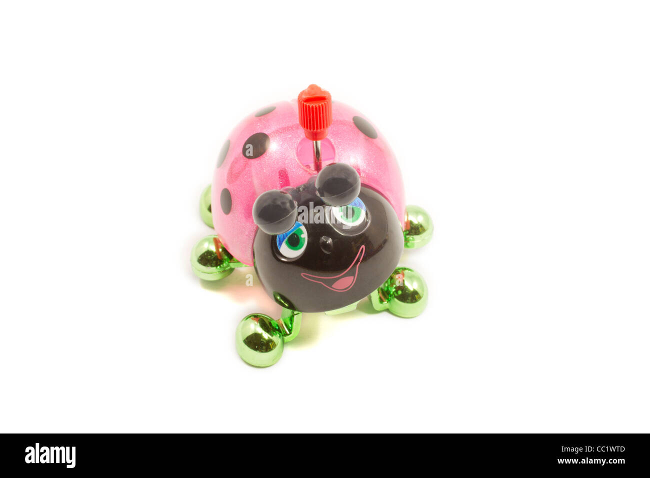 A colorful pink, black, and green toy wind up ladybug ready to be played with Stock Photo Alamy