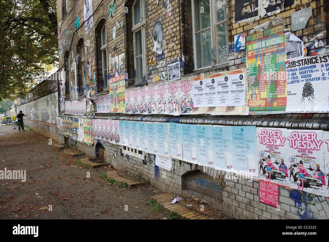 Man putting up posters Stock Photo Alamy