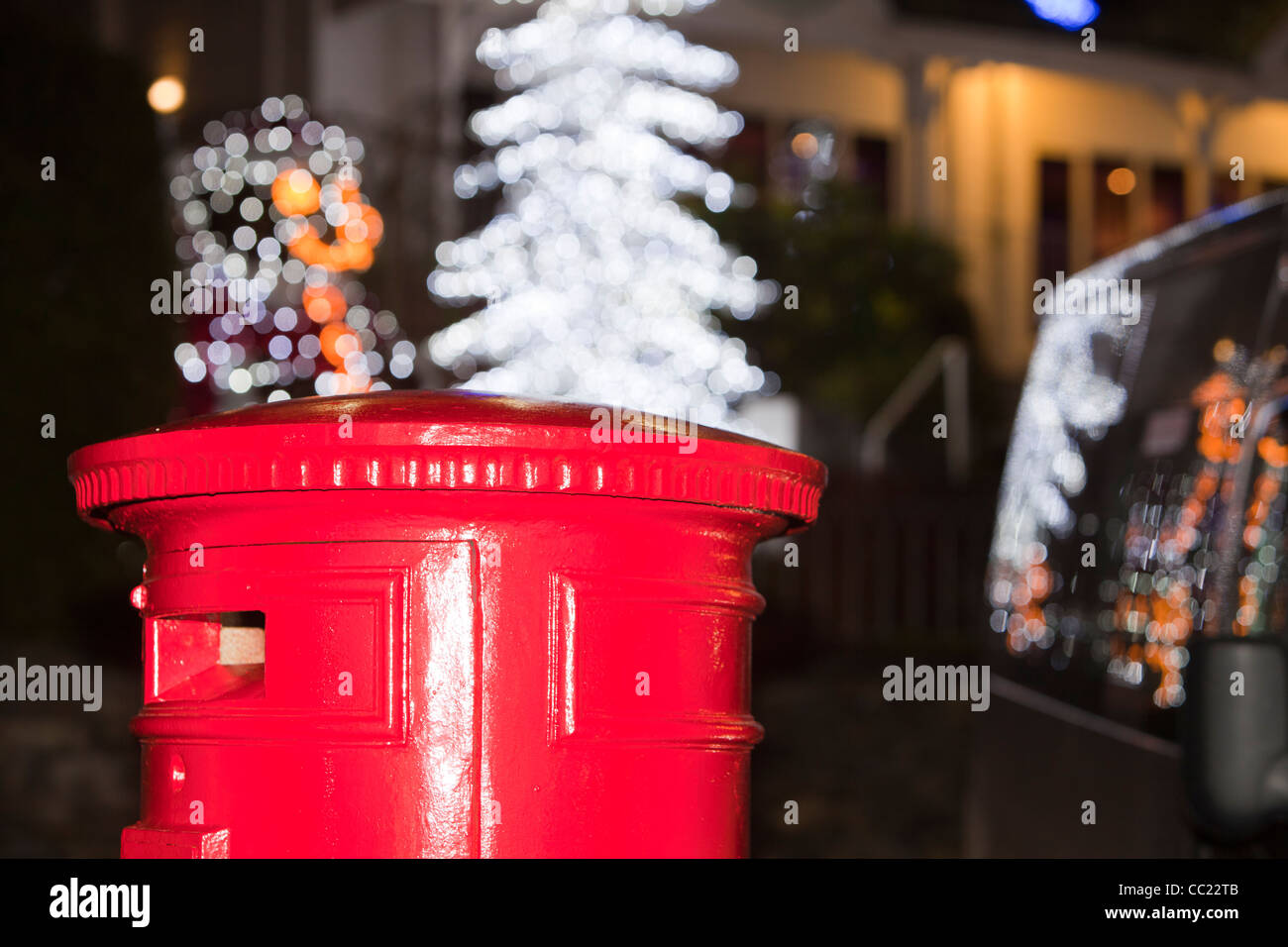 A christmas tree and post box in the centre of Ambleside, Lake District, UK. Stock Photo