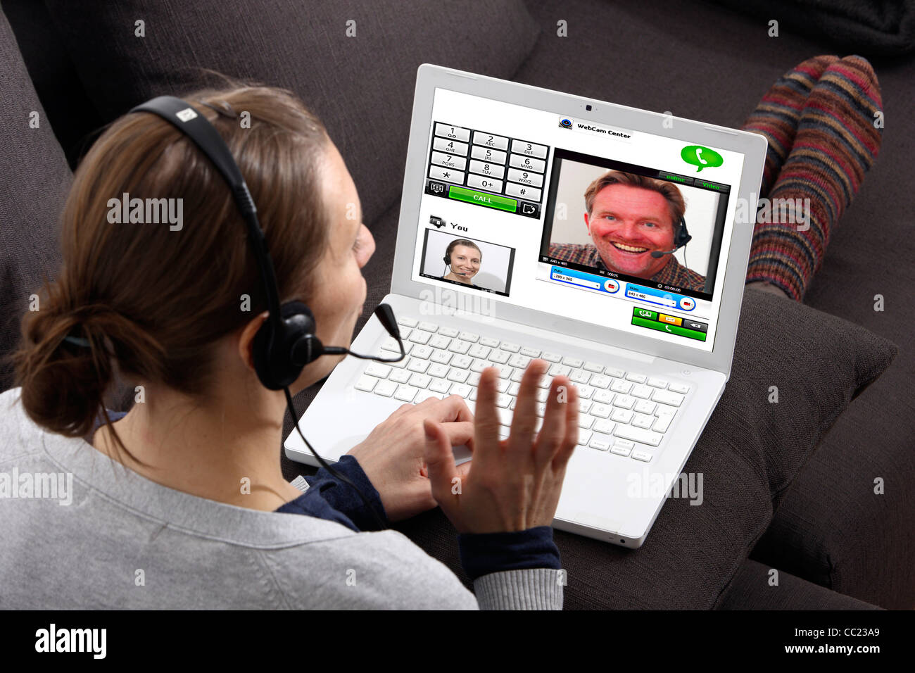 Two people talking over the Internet. Video chat with, with web cam and  headset through voice over IP, VOIP. Live online chat Stock Photo - Alamy