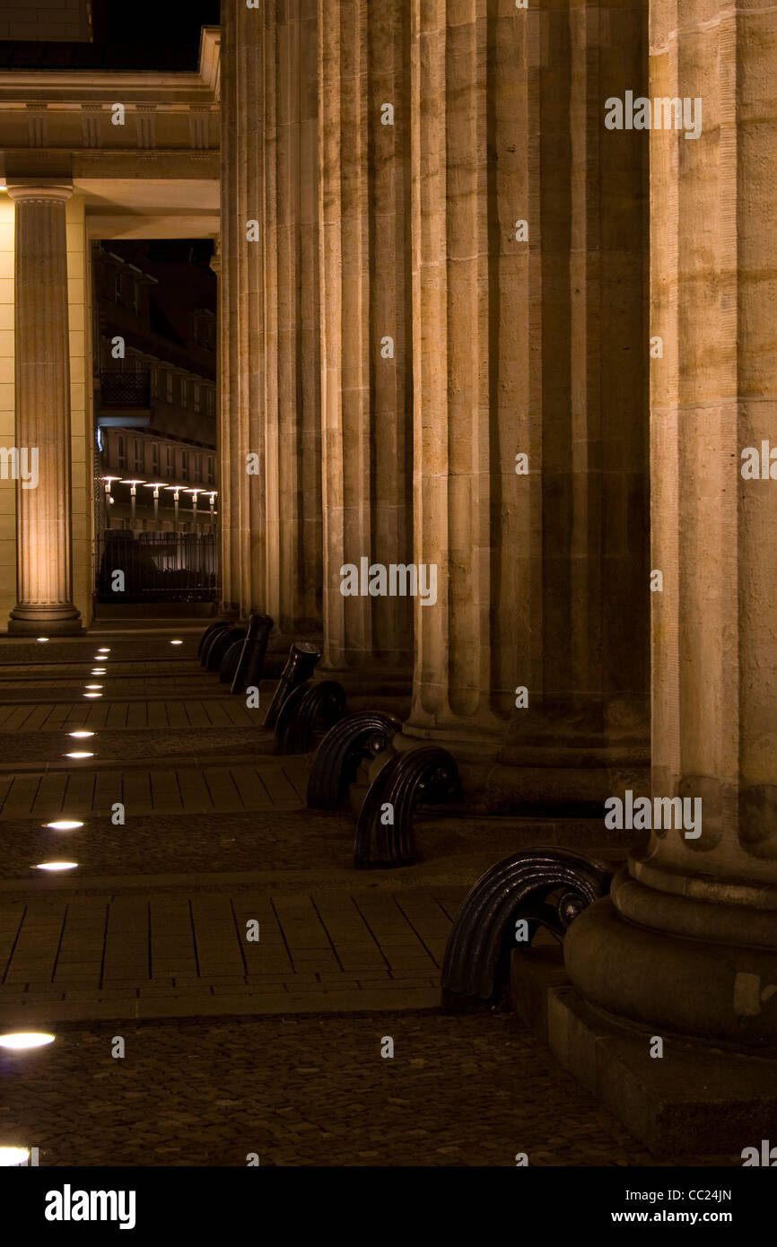The pillars and lights at the foot of the Brandenburg Gate in Berlin at night. Stock Photo