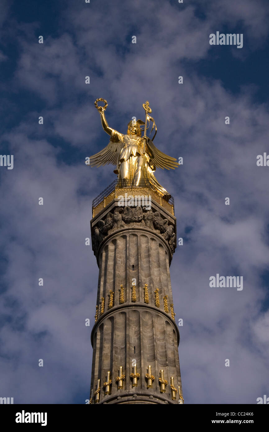 The gold statue of Victoria at the top of the Victory Monument in Berlin. Stock Photo