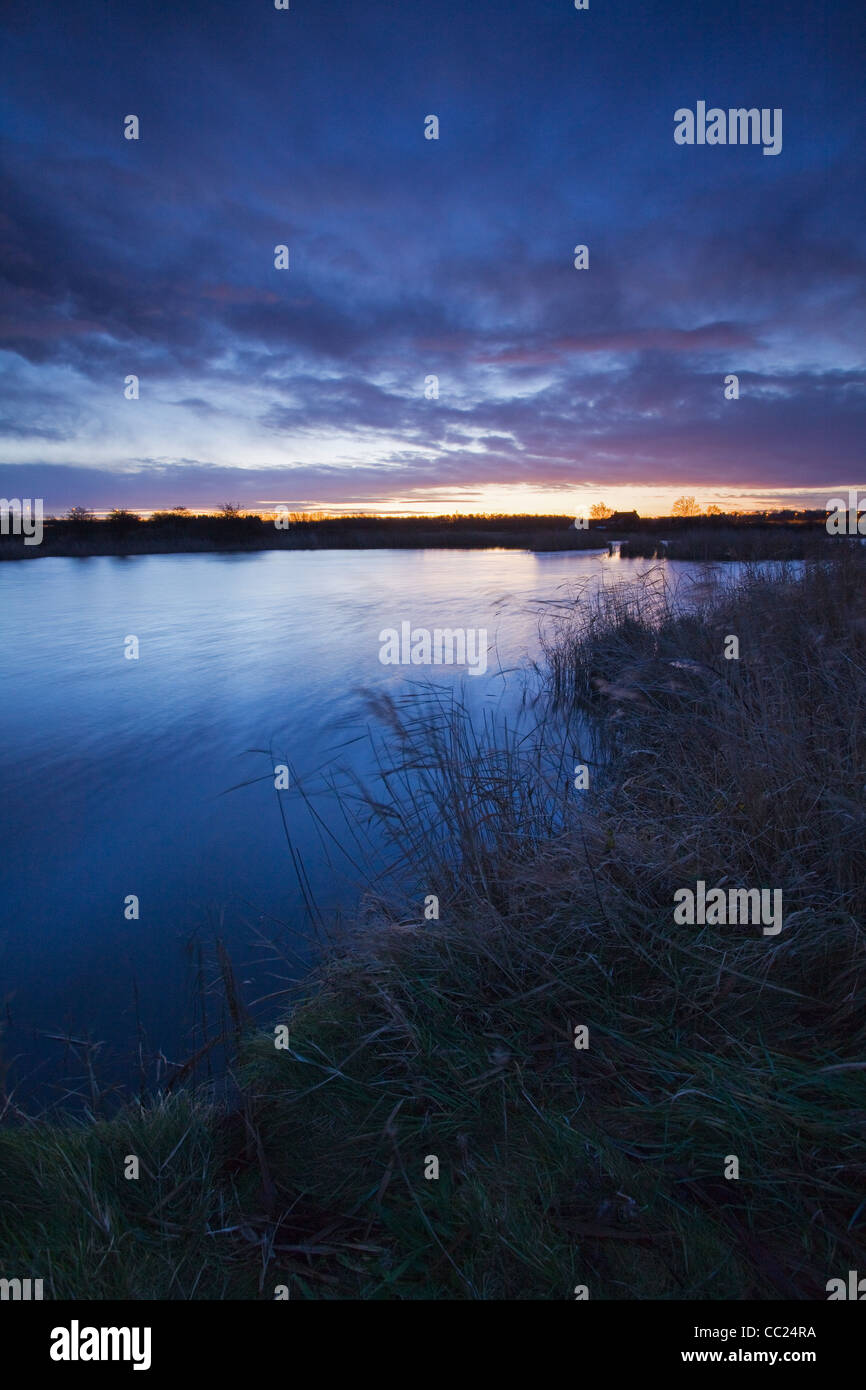 A colourful sunrise at the Far Ings National Nature Reserve in North Lincolsnhire on a cold January morning Stock Photo