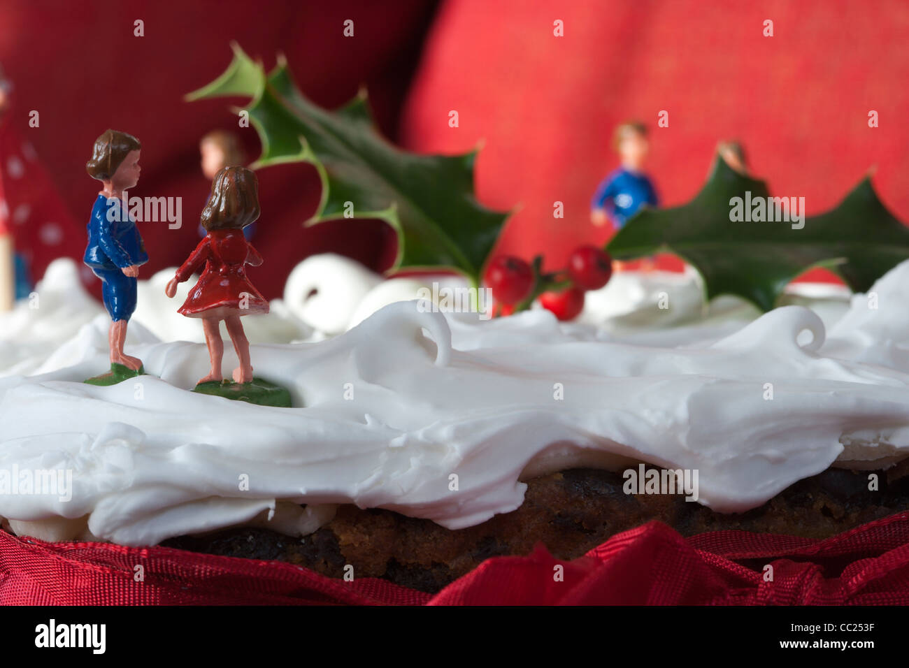 Christmas Cake with snow scene on top. Stock Photo