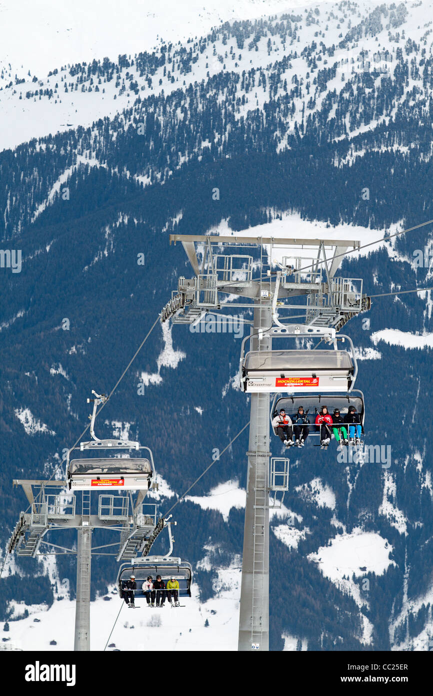 Skiers on chair lift in Hochzillertal ski region Kaltenbach Tyrol, Austria Stock Photo