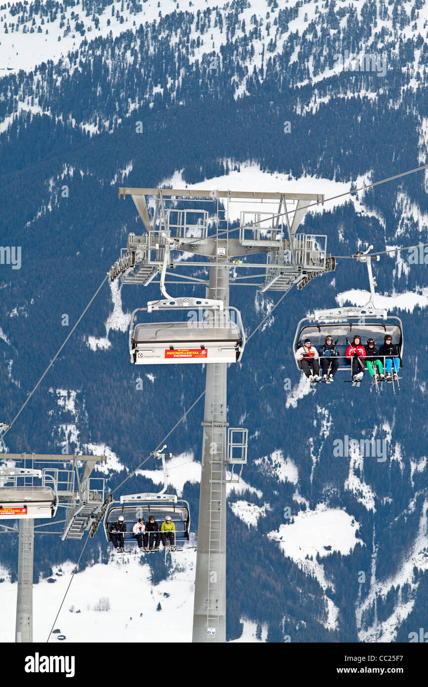 Skiers on chair lift in Hochzillertal ski region Kaltenbach Tyrol, Austria Stock Photo