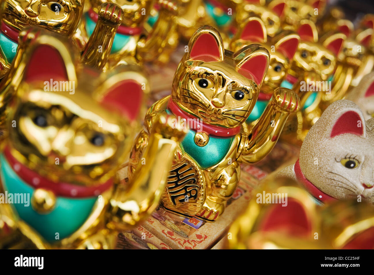A 'Welcoming Cat' (also known as Maneki Neko) - which is popular in Chinese and Japanese culture as a symbol of good fortune. Ch Stock Photo