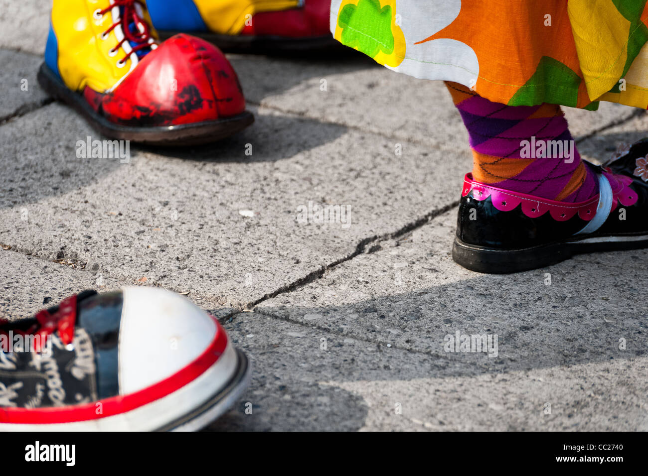 Clowns wear oversized colorful shoes during the Clown Congress in San