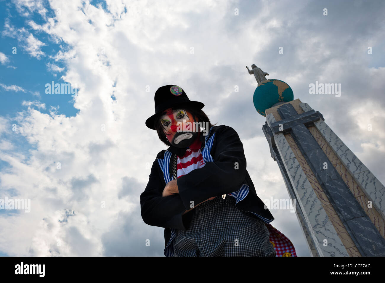 A clown, a participant of the Clown Congress, poses for a picture on Plaza Salvador del Mundo in San Salvador, El Salvador. Stock Photo