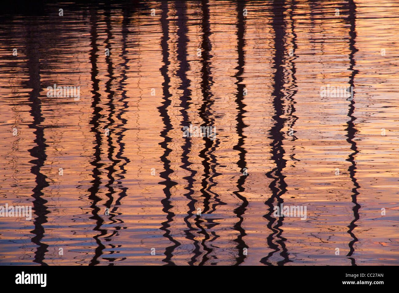 Abstract reflections in water of sail boat masts colorful Stock Photo ...