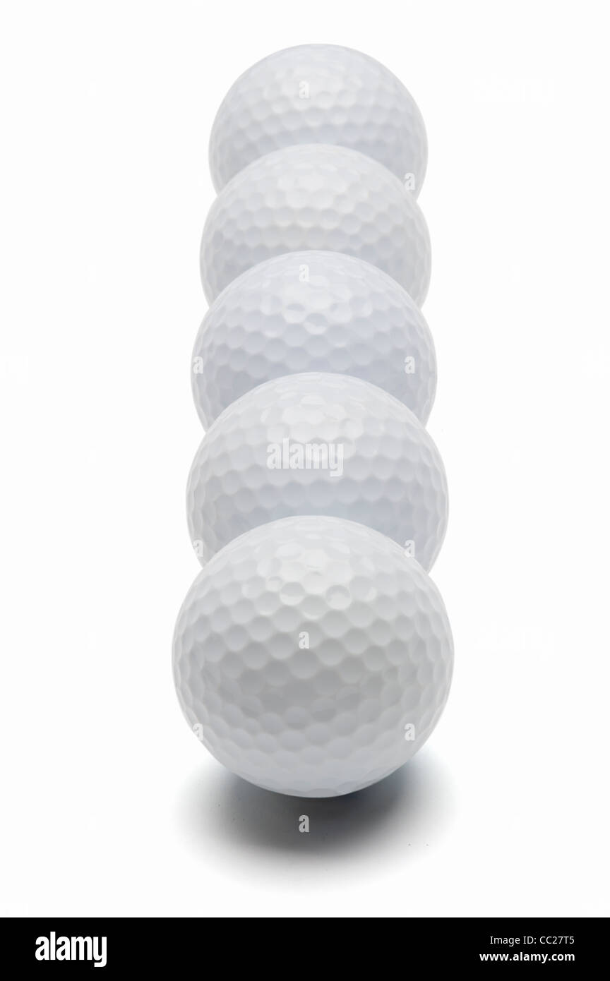 Golf balls in a row Stock Photo