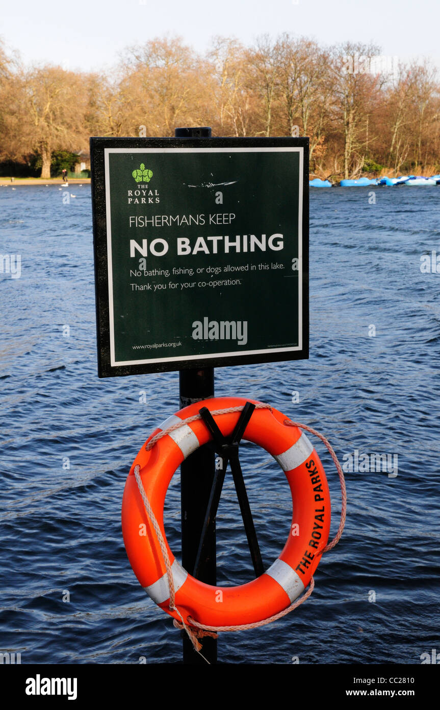 No Bathing Sign and Lifebelt by The Serpentine, Hyde Park, London, England, UK Stock Photo
