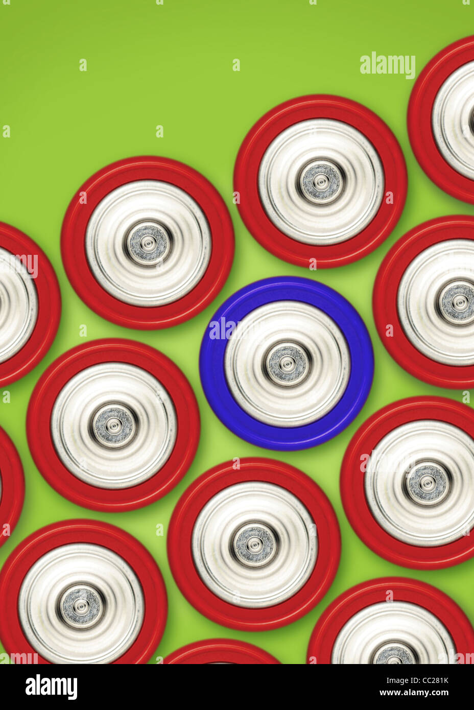A blue battery amongst a group of red batteries Stock Photo