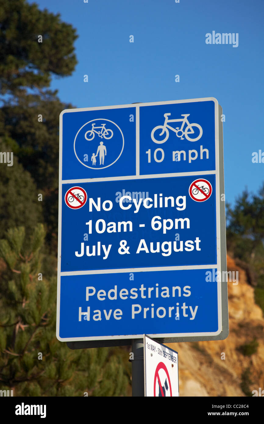 Signs along Bournemouth seafront no cycling pedestrians have priority Stock Photo