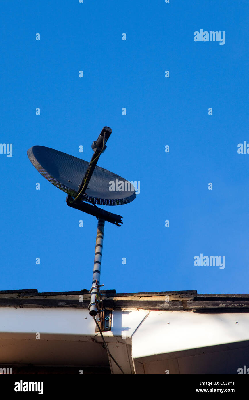 Television satellite dish and a blue sky Stock Photo Alamy