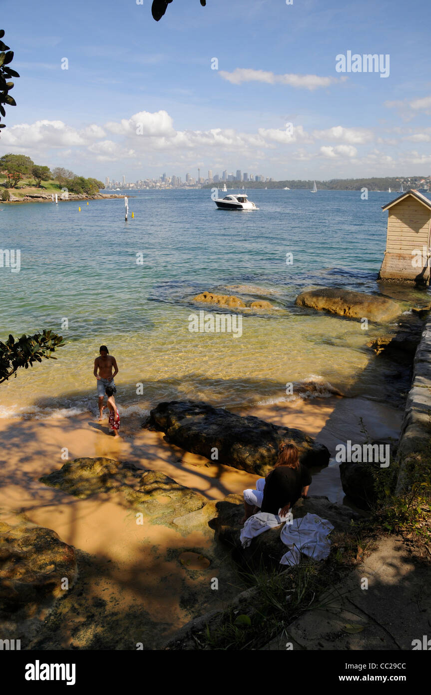 A family relaxing in a sheltered cove at Watsons Bay near Sydney in New South Wales, Australia. Stock Photo