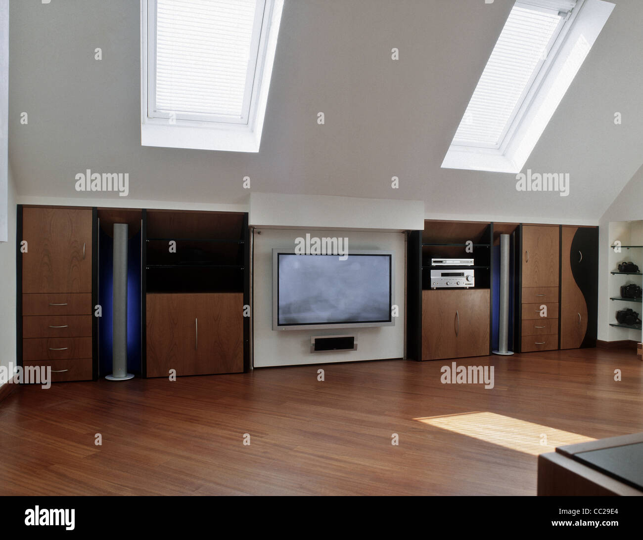 living room in the loft with wood floor and two skylights Stock Photo ...