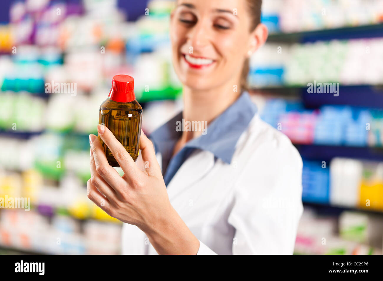 Young woman pharmacist standing hi-res stock photography and images - Alamy