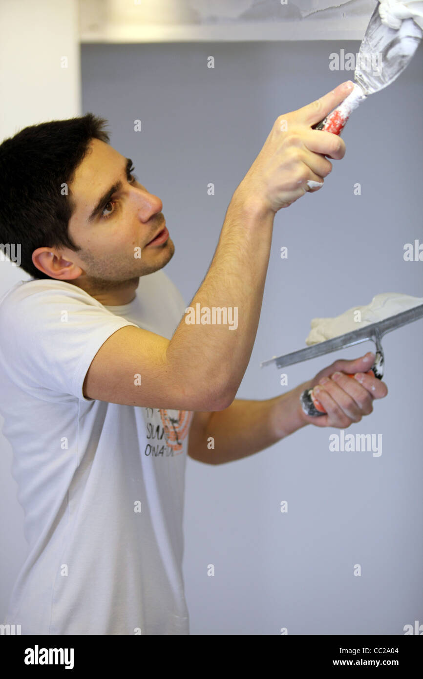 Decorator using filler Stock Photo - Alamy