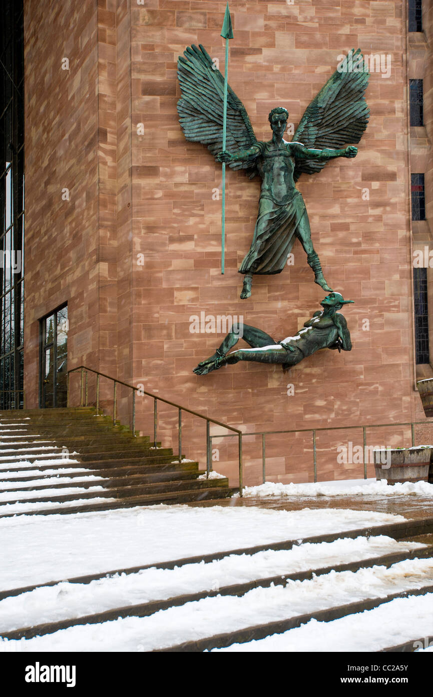 St Michaels, Coventry New Cathedral, designed by architect Sir Basil Spence. Bronze sculpture depicting St Michael's Victory over the Devil. Stock Photo
