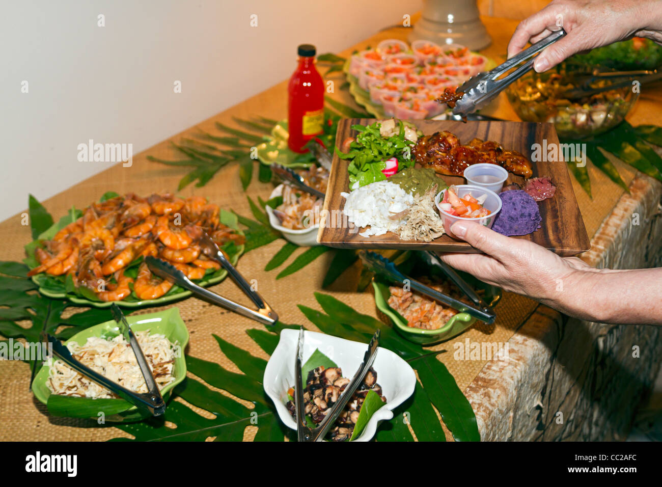 Guests at Pai #39 ina a feast of traditional Hawaiian foods served Guests at Pai #39 ina a feast of traditional Hawaiian foods served