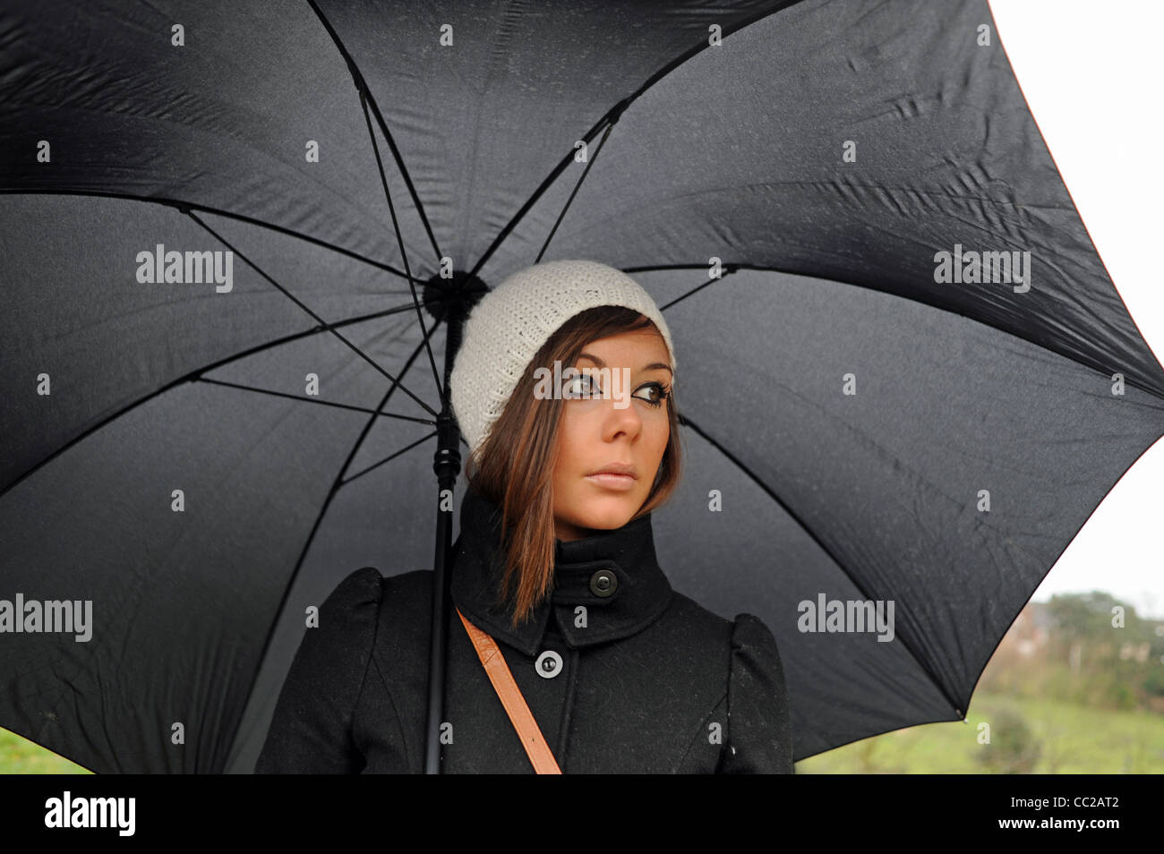 Woman wearing umbrella hat hi-res stock photography and images - Alamy