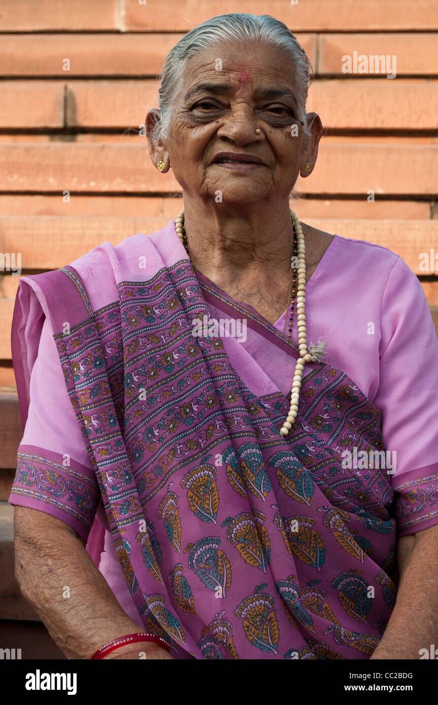 Older Indian woman at Lotus or Baha'i Temple, New Delhi, India Stock Photo