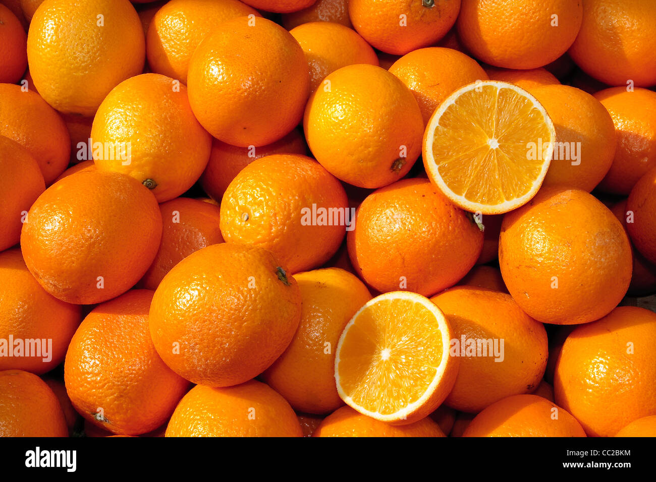 Basket of oranges at local market Stock Photo