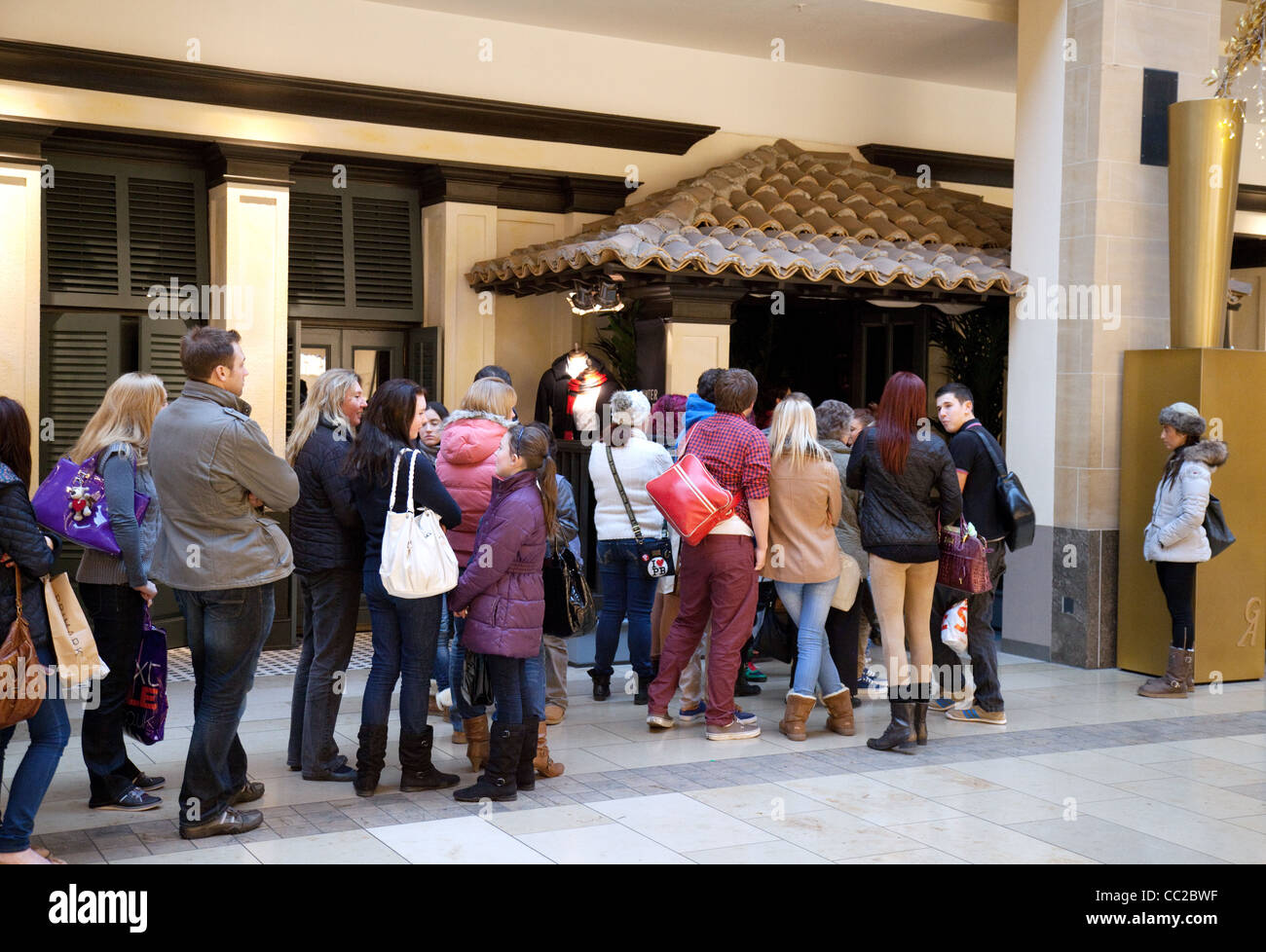 People queuing outside Hollister fashion store, the Grand Arcade Cambridge UK Stock Photo