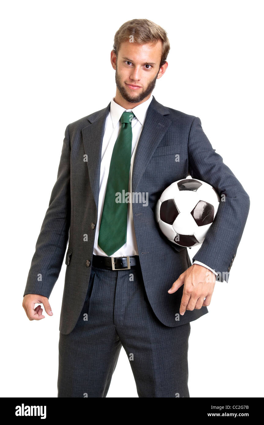 Businessman with soccer ball posing Stock Photo - Alamy
