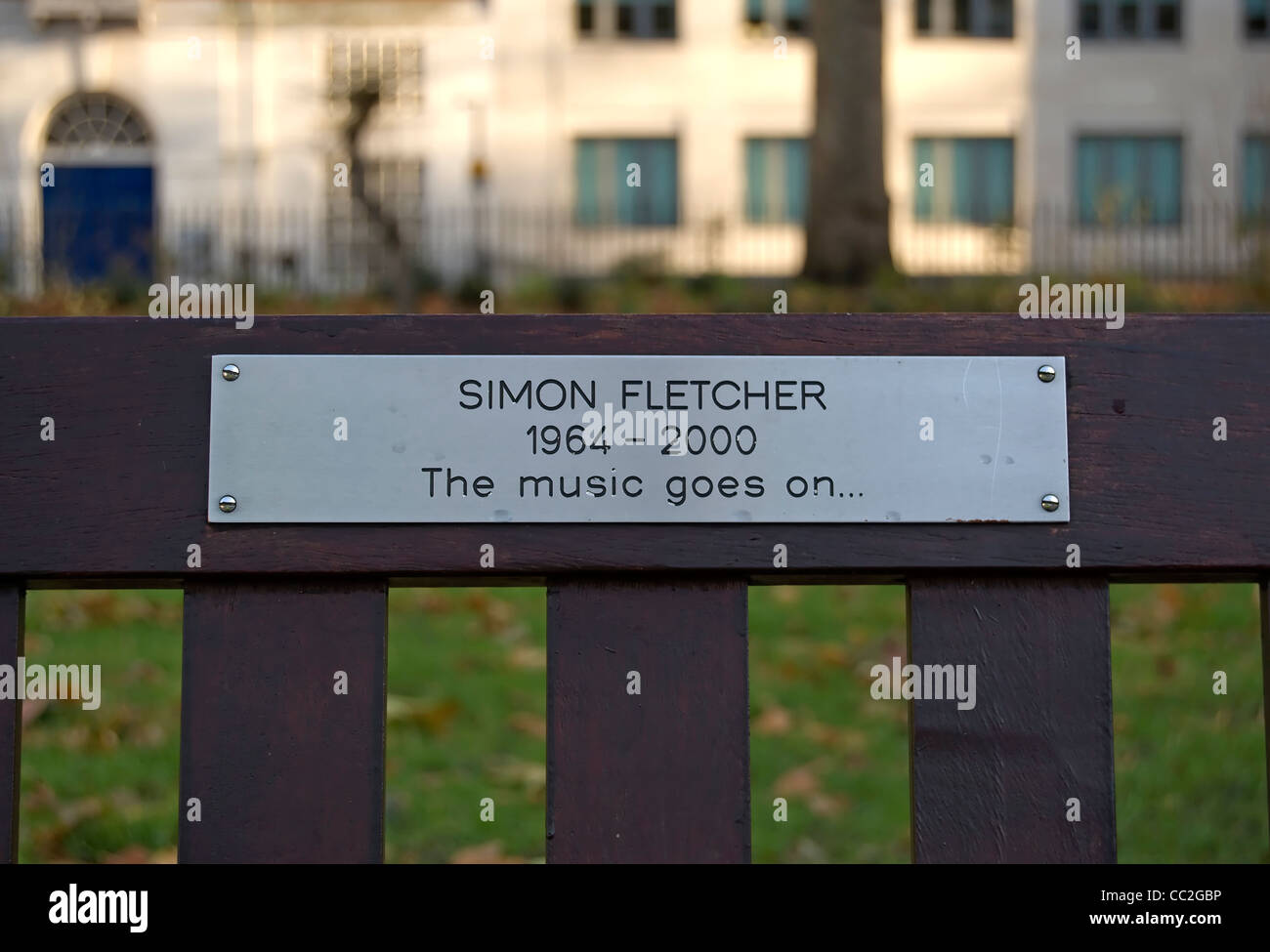 bench memorial in tavistock square, london, england, to simon fletcher, who worked with the english national opera Stock Photo