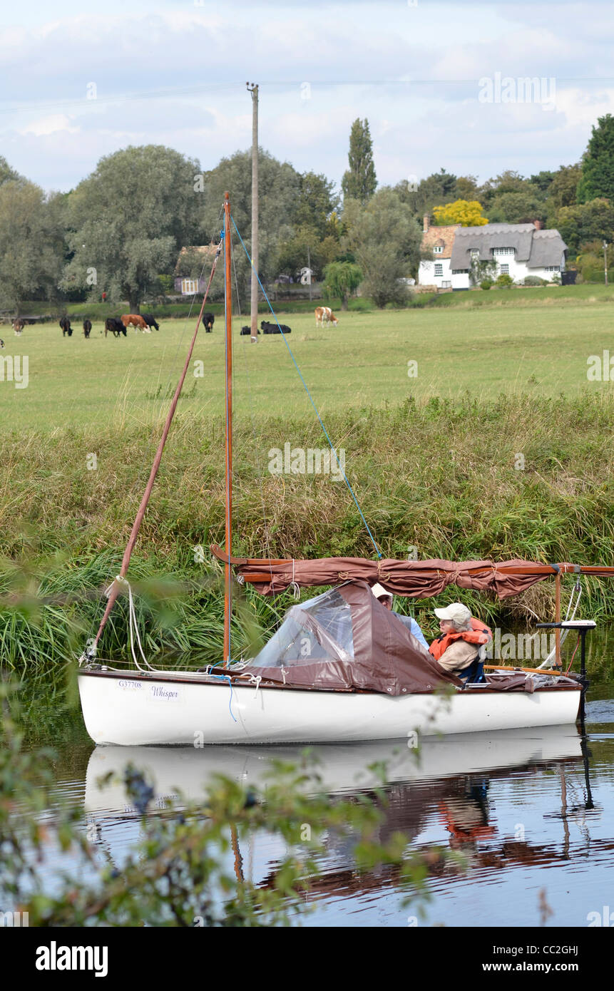 elderly couple boating on river great ouse at fen drayton cambridgshire united kingdom Stock Photo