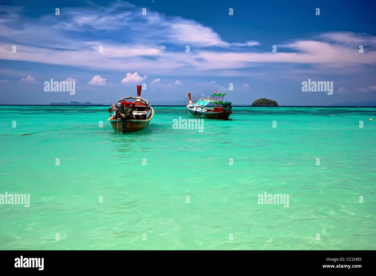 Emerald seas and blue skies on the Andaman Sea Island of  Koh Lipe located in Satun Province in the deep South of Thailand. Stock Photo