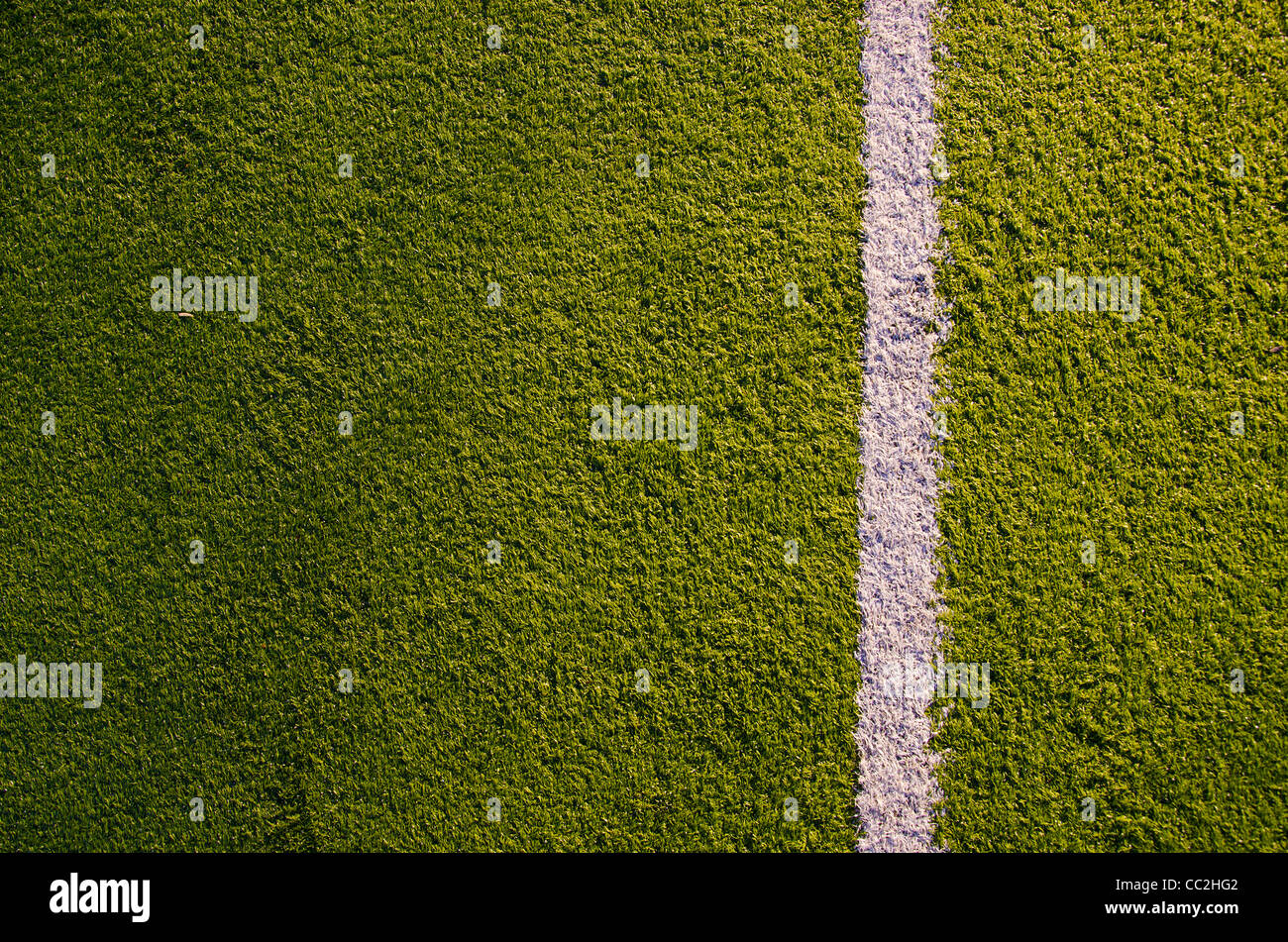 Synthetic sports grounds coating. White marking line details and background. Stock Photo