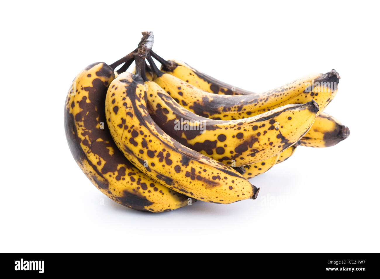 over ripe, overripe, over-ripe bunch of bananas isolated on a white background Stock Photo
