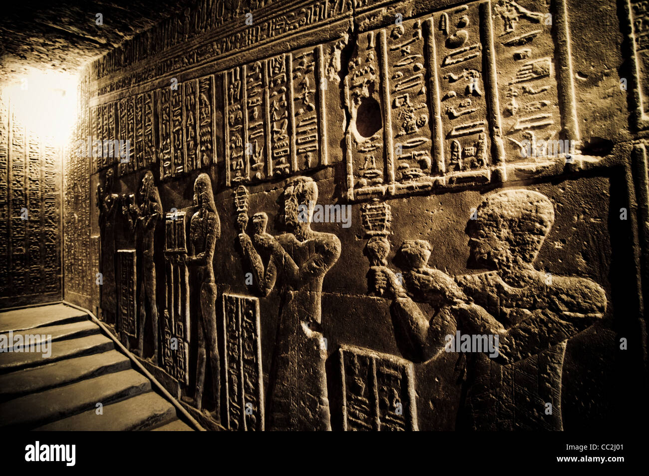Wall reliefs of priests in the tunnels at the Temple of Dendera, Egypt