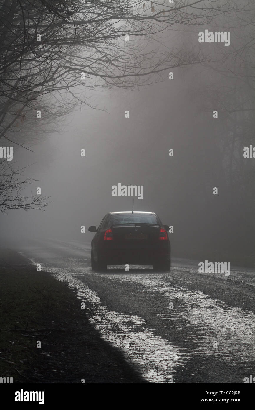 car driving in heavy fog Stock Photo Alamy