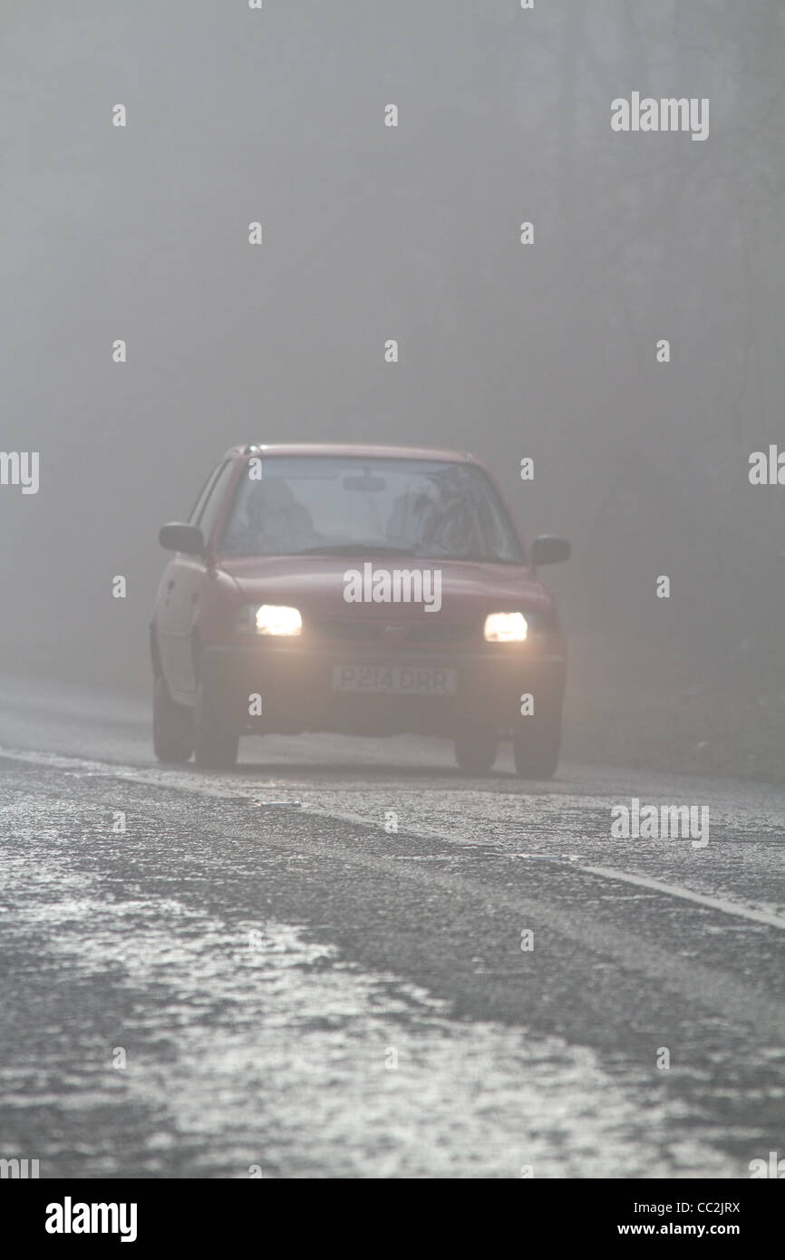 car driving in heavy fog Stock Photo Alamy