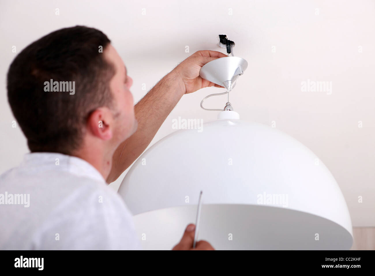 Man Fixing Ceiling Light Stock Photo 41855899 Alamy